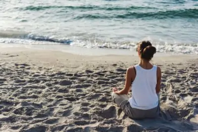 young woman practicing yoga PQDUBUS