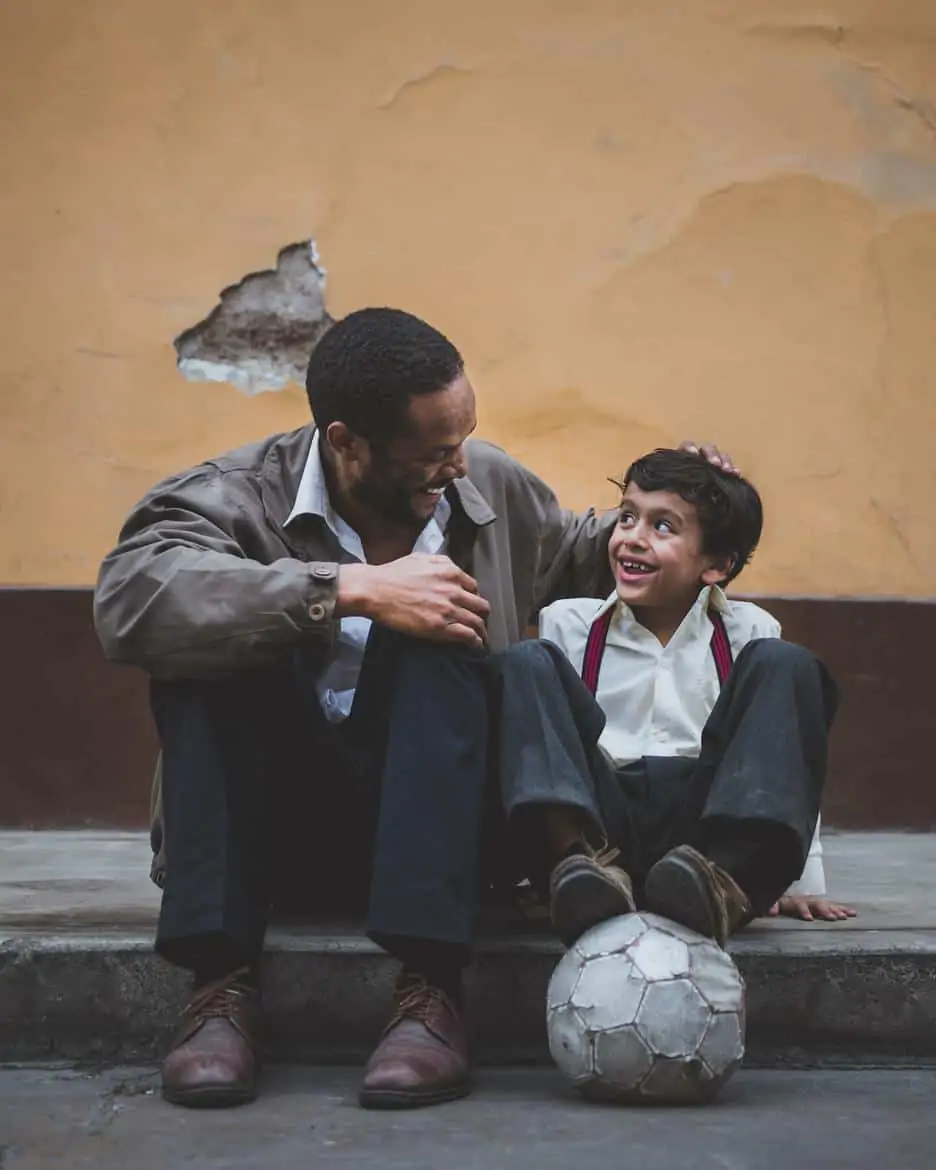 father and son smiling