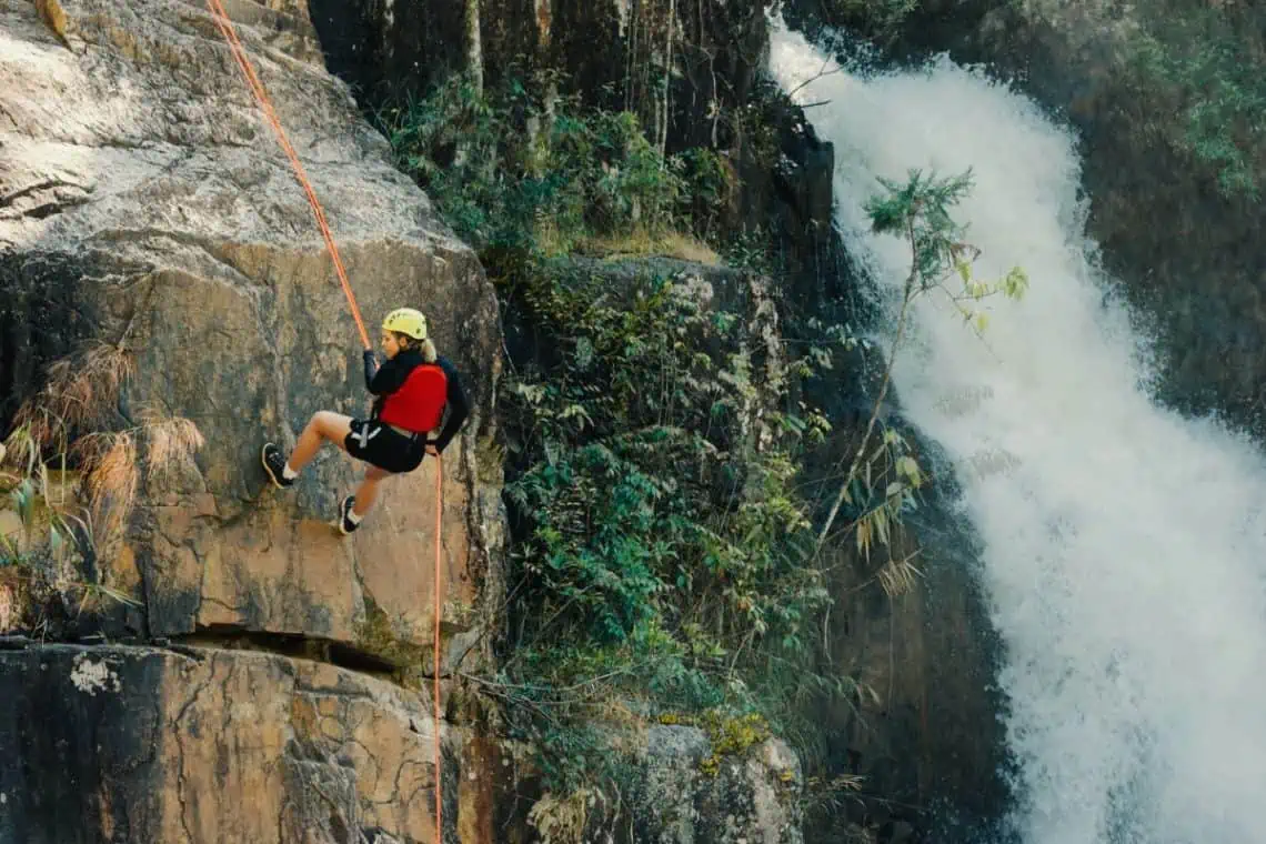 rock climbing near a waterfall