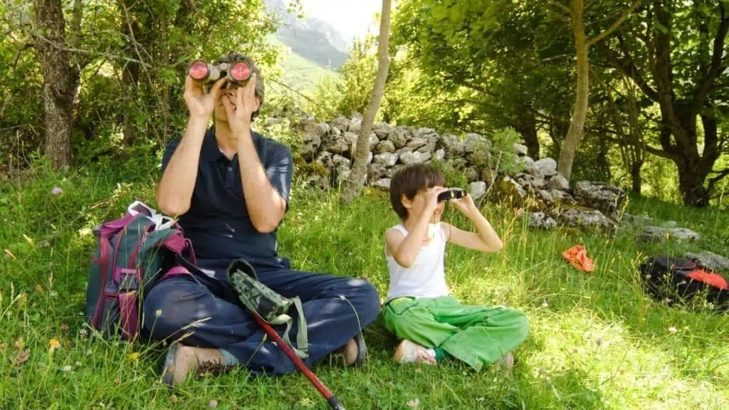 father and son birdwatching