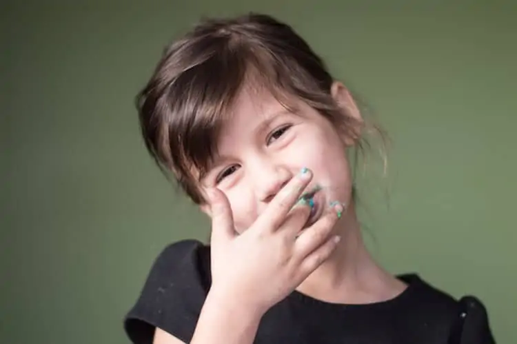 Girl Eating Frosting